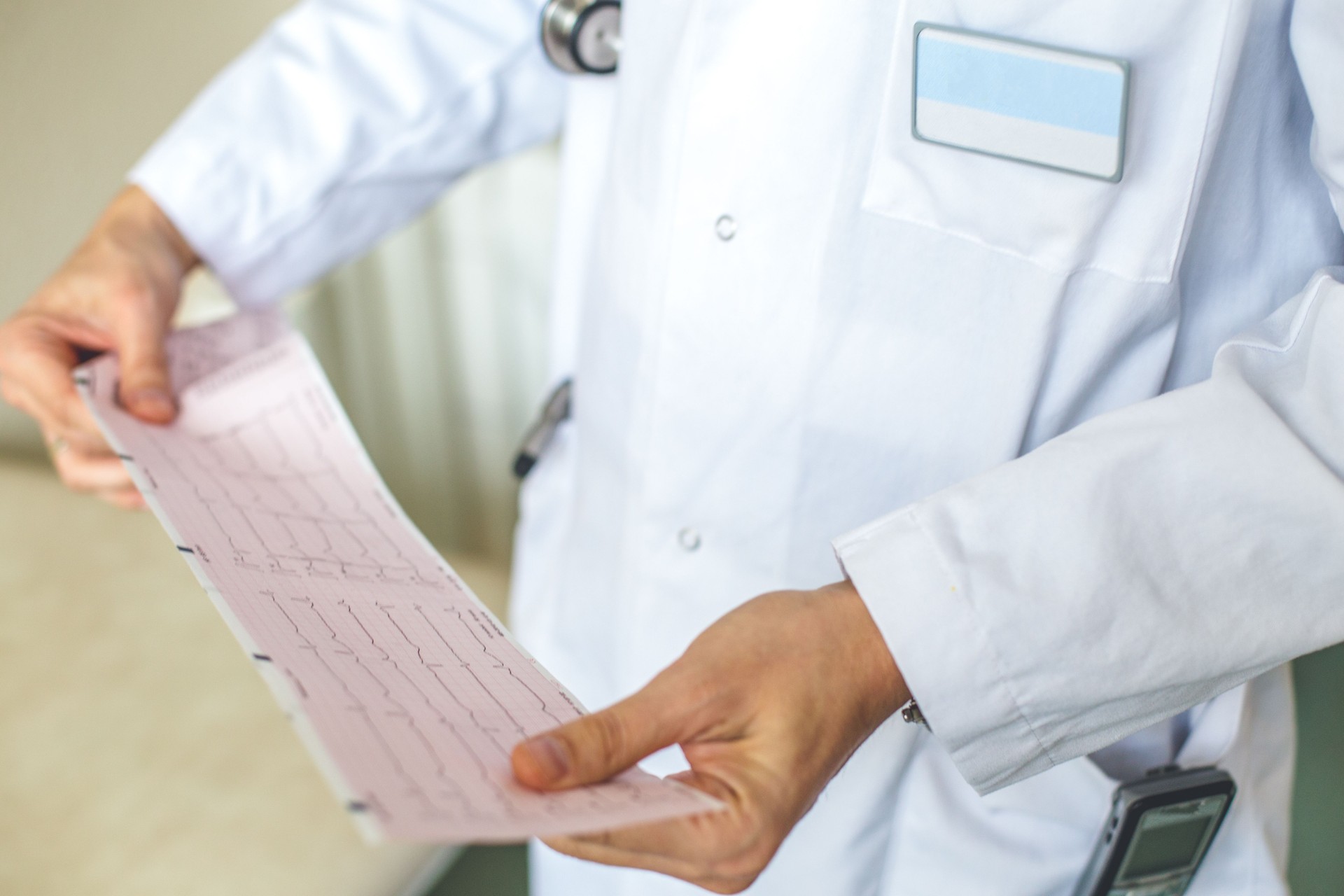 Doctor holding  Electrocardiogram results